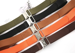Detail of high-strength nylon tactical belts with quick-release metal buckles in multiple colors