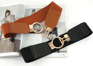 Detailed view of elastic wide belts with stylish golden ring buckle in black and brown