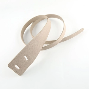 Minimalist beige pebble leather waist belt with unique rectangular slot closure for coats