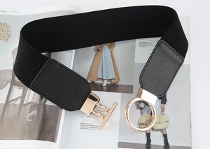 Detailed close-up of black wide elastic waist belt featuring gold-tone round buckle