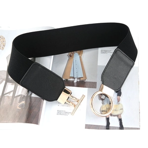 Women's wide elastic waist belt in black with gold metal ring and T-bar buckle closure