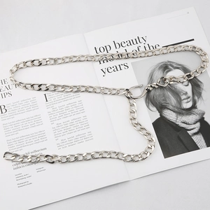 Chunky silver metal curb chain belt for jeans with large clasp on fashion magazine