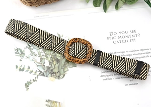 Close-up of woven PP straw belt featuring a leopard print buckle and bohemian texture