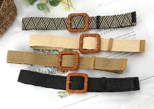 Detail view of woven bohemian belts in four colors with wooden square buckles