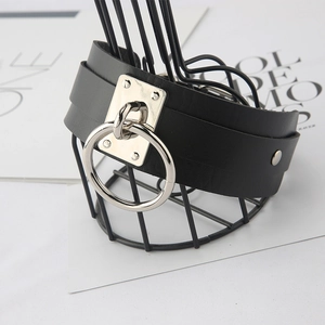 Gothic black PU leather collar with large silver ring and studs on a mesh stand