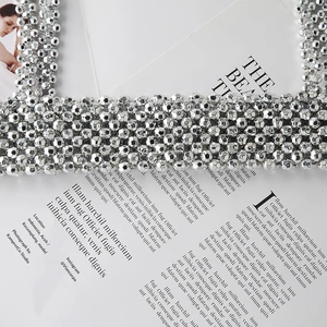 Macro shot of silver faceted beaded chain accessory for shirts and dresses