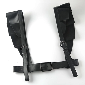 Detail view of gothic black PU leather body harness with ruffled lace shoulder straps