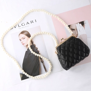 Quilted black mini heart bag with vintage gold clasp and elegant pearl chain strap