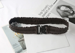 Detail of dark brown elastic pleated belt with a black plastic tactical buckle closure