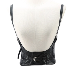 Gothic punk black PU leather harness corset with adjustable buckles on white mannequin