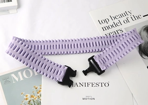 Detail of lavender elastic waist belt with wave texture and black quick-release buckle