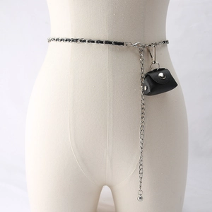 Detail of silver metal chain belt with woven black leather and mini pouch on mannequin