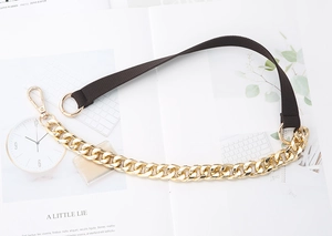 Detail view of gold metal chain and brown woven strap for bag accessory and strap replacement