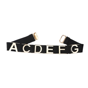 Elastic black waist belt for dresses with gold metal letters and snap buckle closure