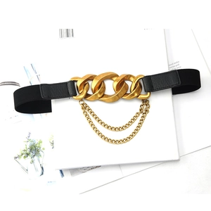 Women's elastic waist belt with vintage gold chain buckle and layered chains on white
