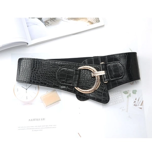 Women's wide black corset belt with crocodile pattern and large golden metal buckle