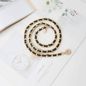 Vintage gold metal chain waist belt with black leather weave and sunflower pendant