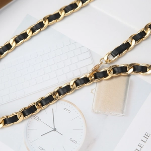Vintage gold metal chain belt with woven black leather and lobster clasp for dresses