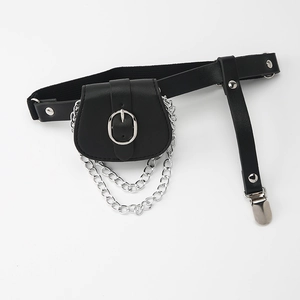 Detail of punk style black PU leather thigh bag with silver chains and adjustable elastic strap