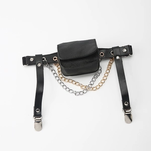 Detail view of punk style black leather leg bag with metal chains and adjustable garter clips