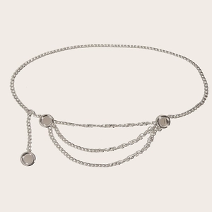 Close-up of elegant silver tiered metal waist chain with circular mirror charms
