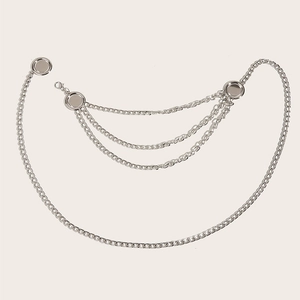Detail view of multi-layer silver metal chain belt with polished round metal charms