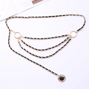Detail of multi-layer golden alloy chain woven with black leather for elegant dress waist decor