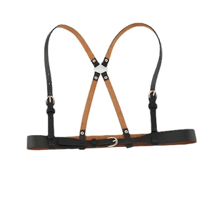 Gothic punk black leather body harness with gold metal buckles on a white background