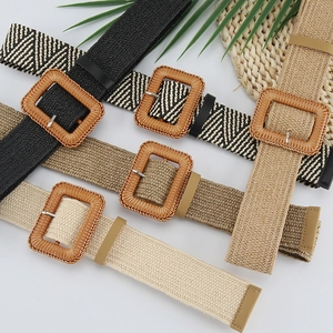 Detail of bohemian woven elastic belts with square buckles in black, khaki and beige tones