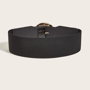 Women's wide black elastic belt with gold circular buckle and faux crocodile texture