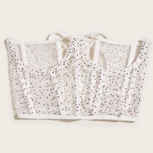 Haut court bustier à paillettes blanches avec baleines et dos lacé sur fond uni