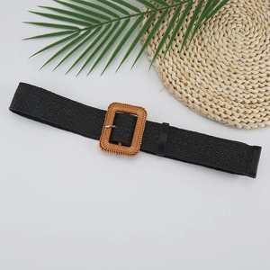 Detail of black elastic woven belt featuring a bohemian brown straw square buckle
