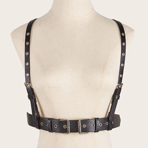 Detail of punk style PU leather corset belt showing silver buckles and eyelet hardware