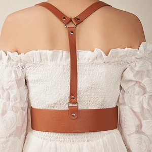 Brown leather corset belt with Y-back shoulder straps and silver metal ring details