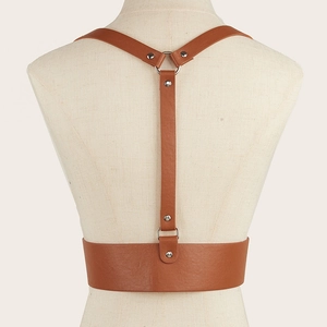 Detailed back view of brown faux leather body harness with silver metal ring and Y-straps