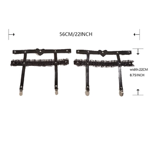 Detailed view of heart-shaped leather leg garter with lace ruffles and metal clips