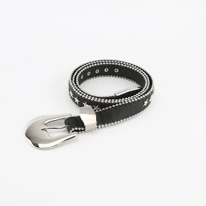 Detail of black leather belt with silver star studs and metal bead chain edges