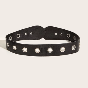 Women's black wide belt in punk style with silver metal eyelets on a clean white background