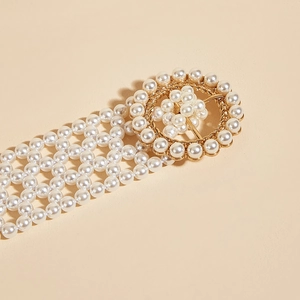 Elegant four-row pearl elastic waist belt with a golden pearl-encrusted circular buckle