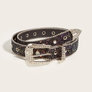 Close-up of rhinestone buckle and colorful sequins on a stylish Western black belt