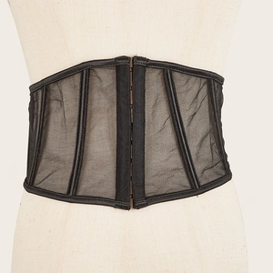 Detail of breathable black mesh corset with metal hook-and-eye closure and boning