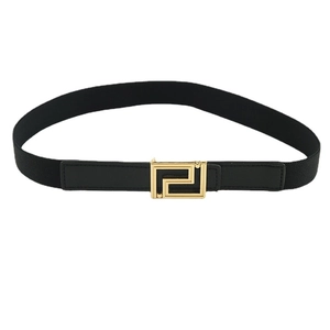 Elastic black waist belt for women with a decorative golden geometric metal buckle