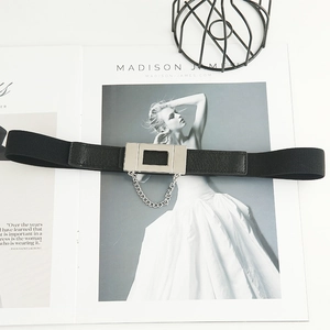 Elastic black waist belt for women with silver metal buckle and delicate chain detail