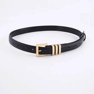 Close-up of black leather belt with rectangular gold buckle and three metal loops