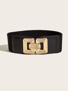 Detail of a wide black elastic waist belt featuring a modern gold interlocking buckle