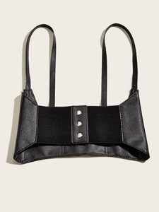 Detail of black leather harness belt featuring silver buttons and elastic back on white