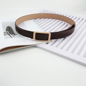 Women's brown leather belt with gold rectangular buckle shown on a white textured background