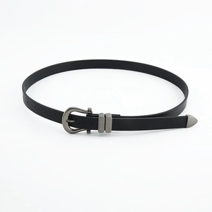 Women's slim black leather belt with vintage silver horseshoe buckle and metal tip accents