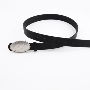 Detail of black leather belt with silver oval buckle featuring embossed number 22 design