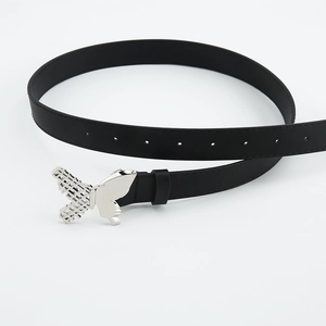 Detail of silver butterfly buckle on black leather belt with hollowed wing pattern